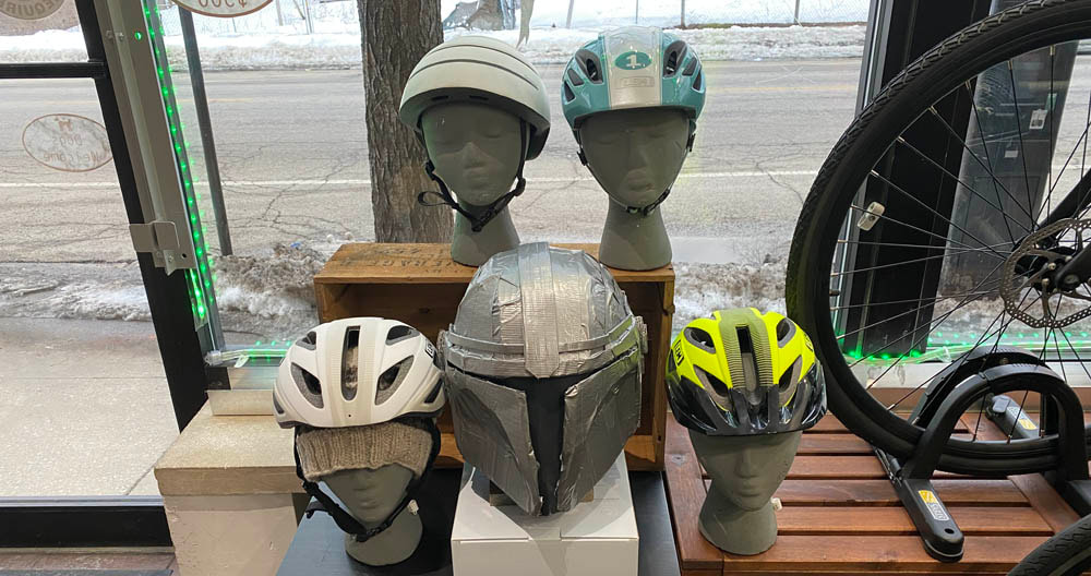 Display of bike helmets, LEM child, LEM Boulevard, and Closca on foam displays