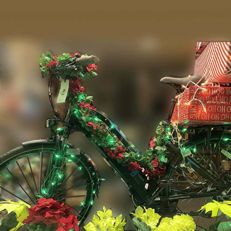 Bicycle decorated with lights and greenery