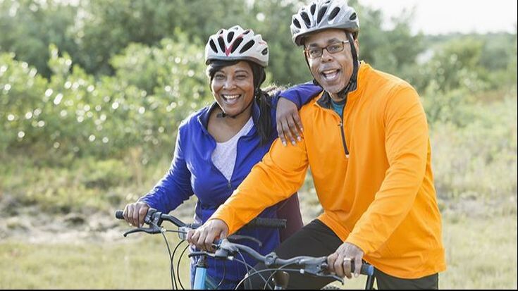 Happy senior couple on bikes