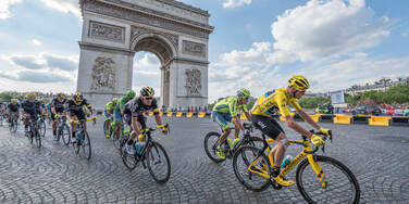 Professional bike riders in the Tour de France riding in Paris