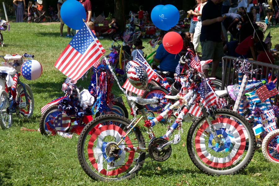 Bikes outside decorated by woman owned bike shop staff in red, white, and blue for July forth holiday
