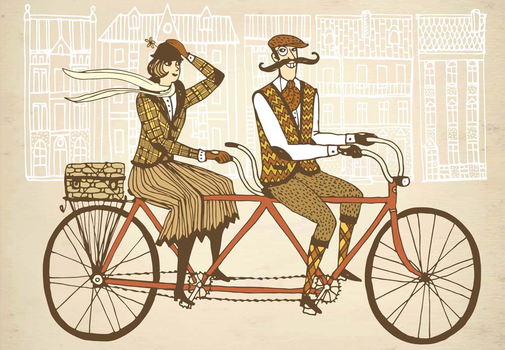 Vintage couple on a bicycle made for two riding in a city