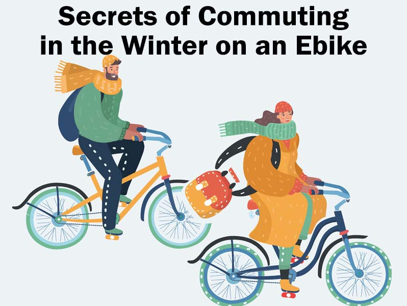 Two people riding bikes dressed for winter riding