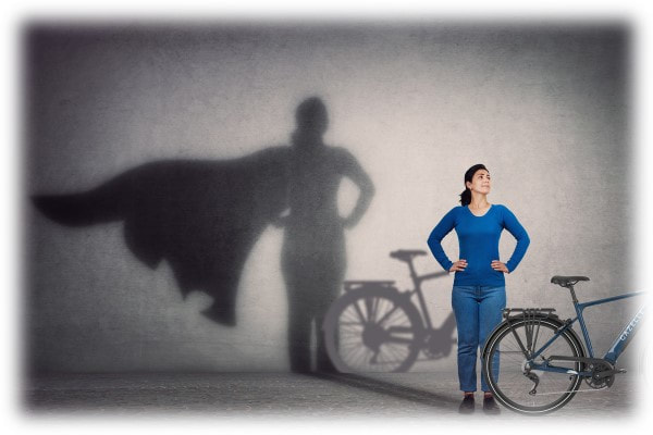 Woman with a Gazelle ebike with superhero shadow